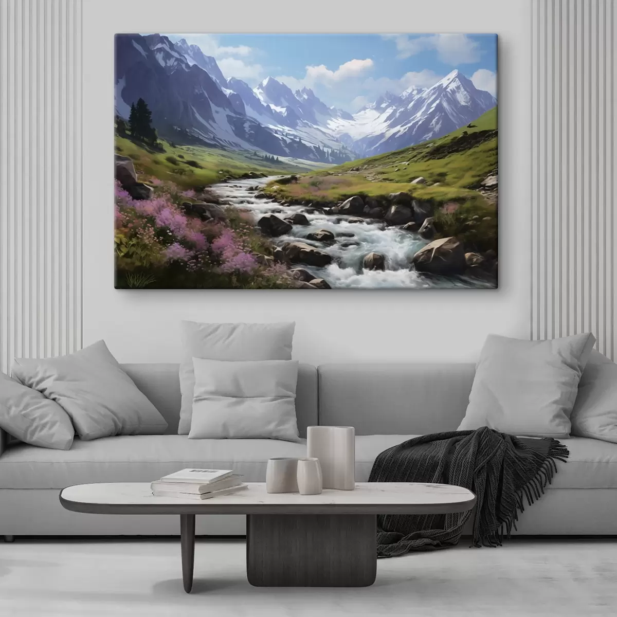 murales de pared Un paisaje montañoso con un arroyo caudaloso, prados en flor y picos nevados en el horizonte bajo un cielo azul brillante. s42563