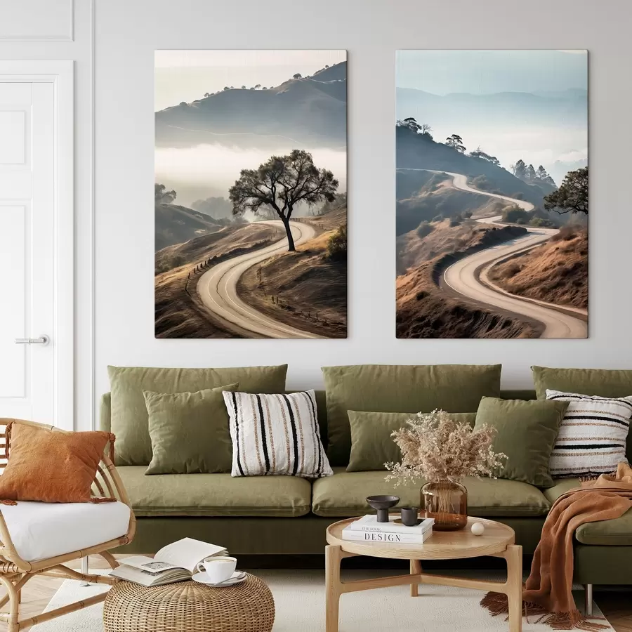 murales de pared Una sinuosa carretera que atraviesa un paisaje montañoso con hierba seca bajo un cielo despejado y montañas en la distancia. m00887
